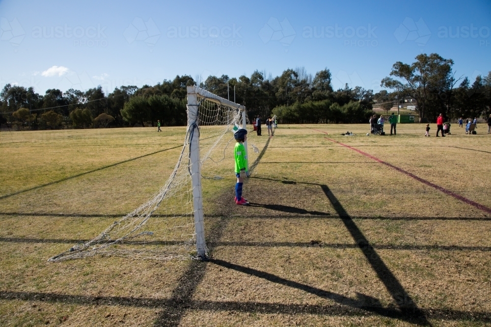 Young girl in a goal at soccer as goalie - Australian Stock Image