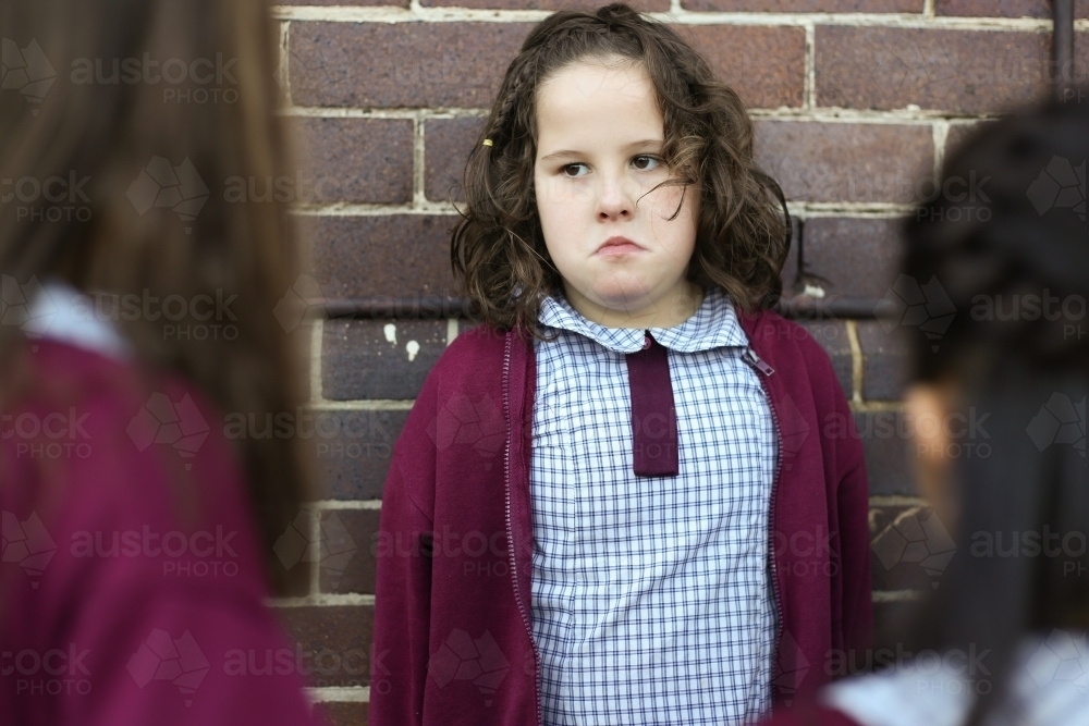 A female school student being bullied by other students in the playground - Australian Stock Image