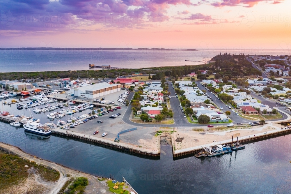 Aerial view of coastal marina at sunset - Australian Stock Image