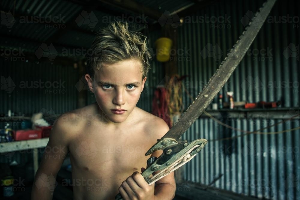 Boy on the farm with cutter - Australian Stock Image