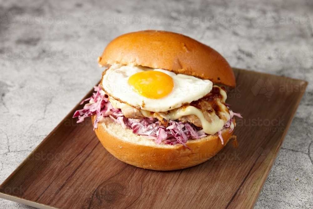 Breakfast burger with egg and red cabbage - Australian Stock Image