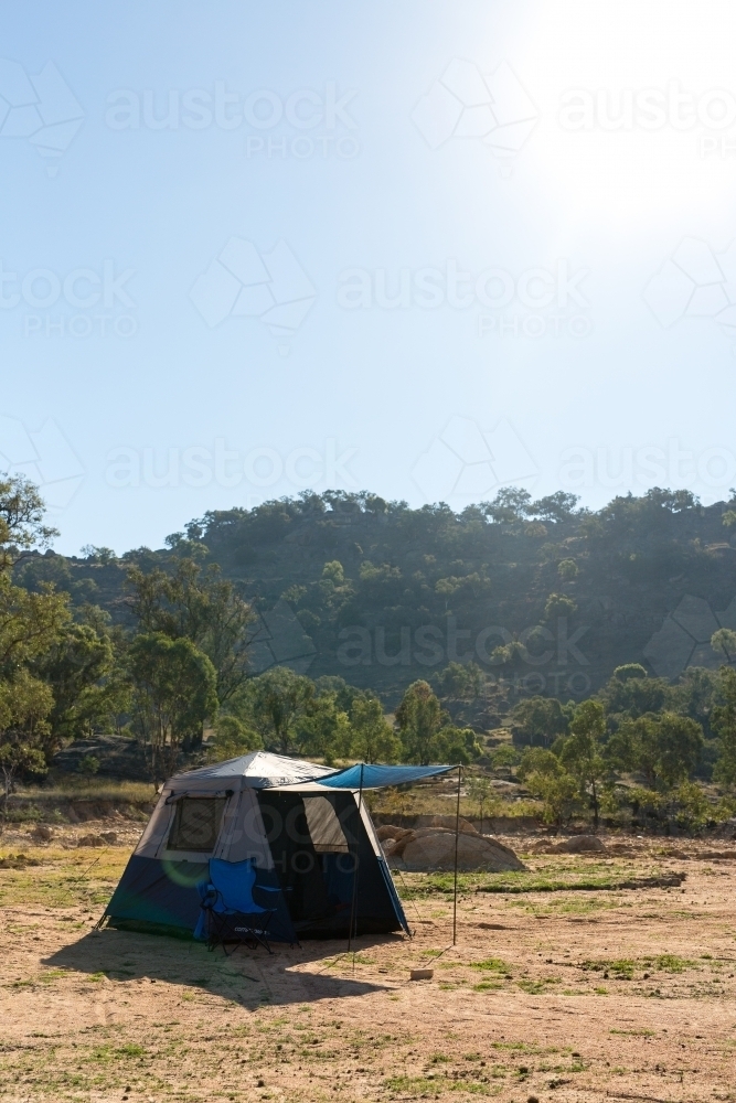 Camping holiday tent and chair at wyangala dam - Australian Stock Image