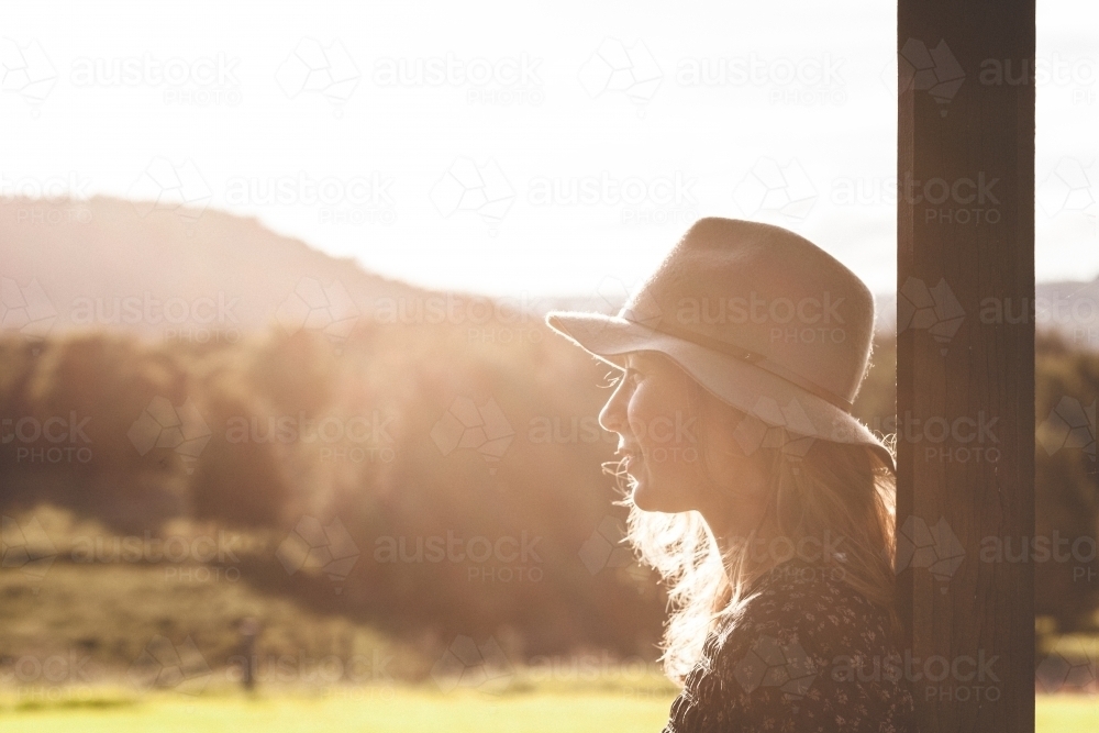 Close-up shot of a woman with countryside in the background - Australian Stock Image
