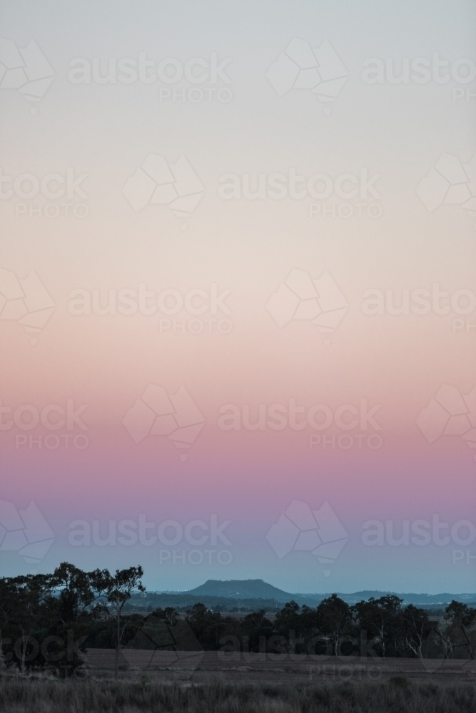 Distant Cowrie Mountain at dusk - Australian Stock Image