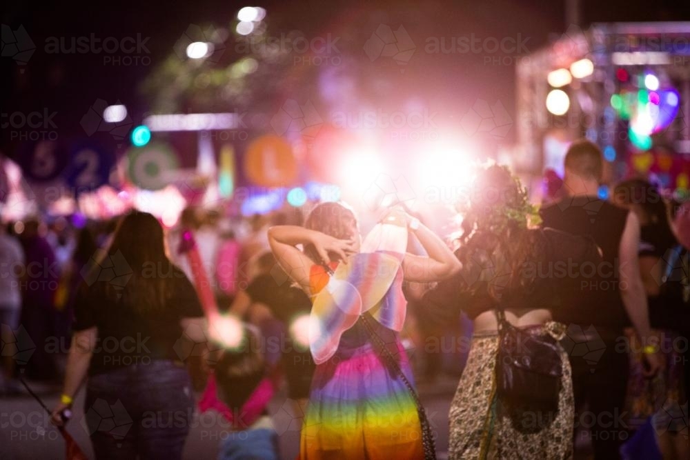Girl dressed as fairy out at a dress up event at night - Australian Stock Image