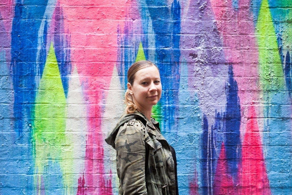 Girl on graffiti background - Australian Stock Image