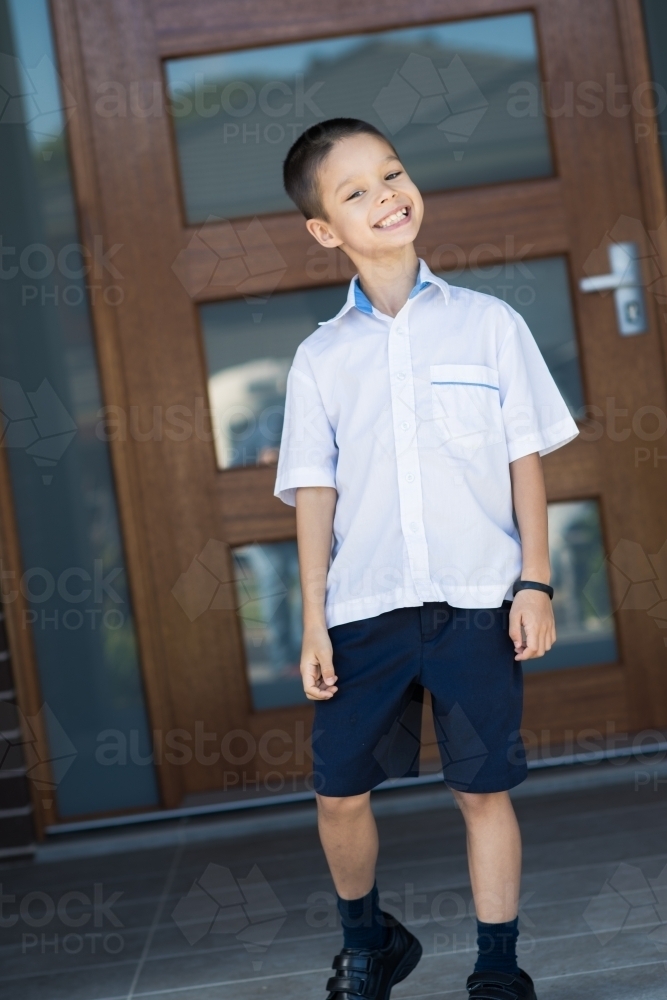 Handsome boys in school uniform leave home for their first day of school - Australian Stock Image