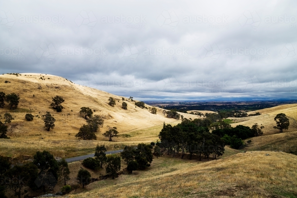 hills in summer under a stormy sky - Australian Stock Image