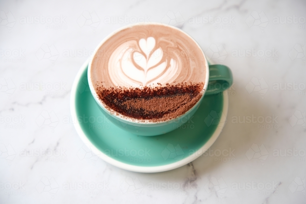 Hot chocolate in teal cup and saucer - Australian Stock Image