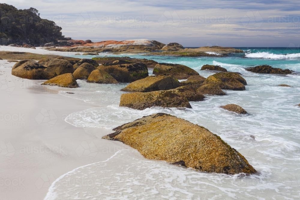 Large rocks at the edge of beach - Australian Stock Image