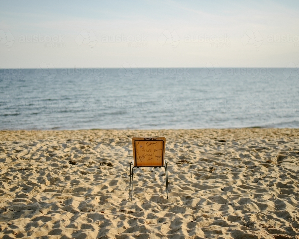 Lone chair left on the beach - Australian Stock Image
