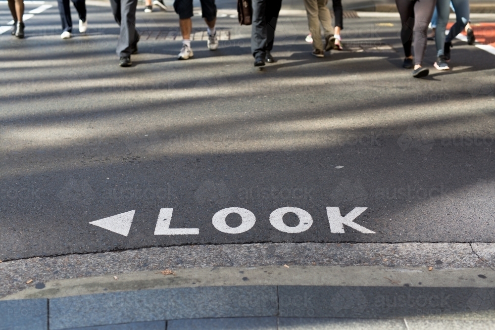 Look sign on a road at a busy intersection in the Sydney CBD - Australian Stock Image