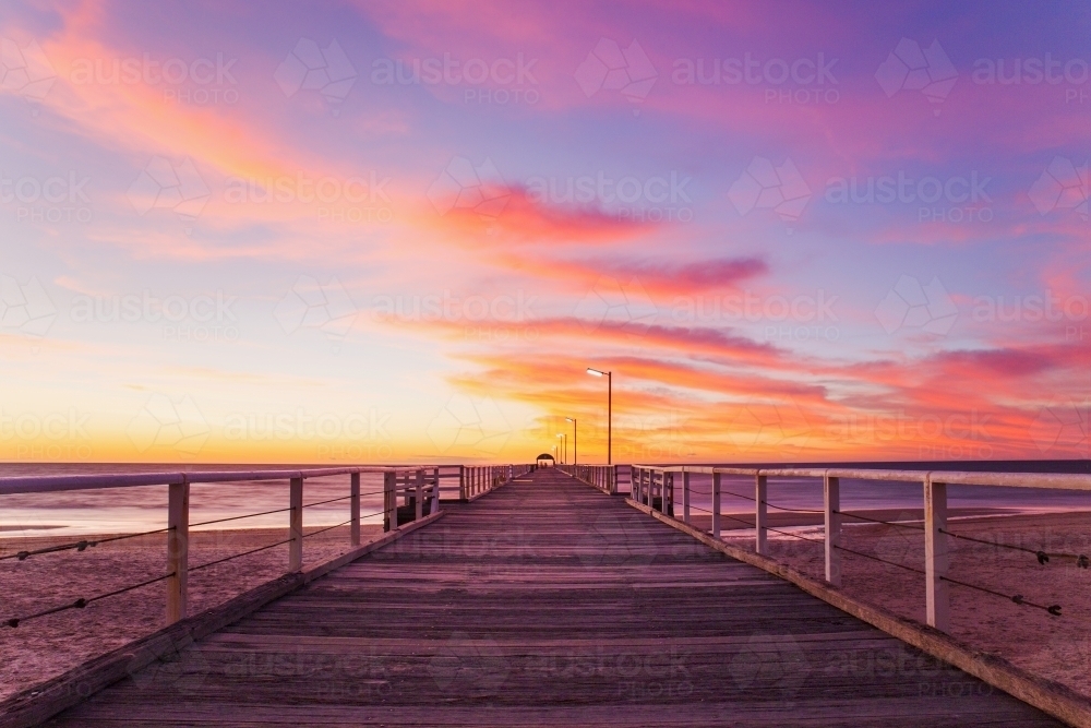 Looking along a jetty at sunset - Australian Stock Image