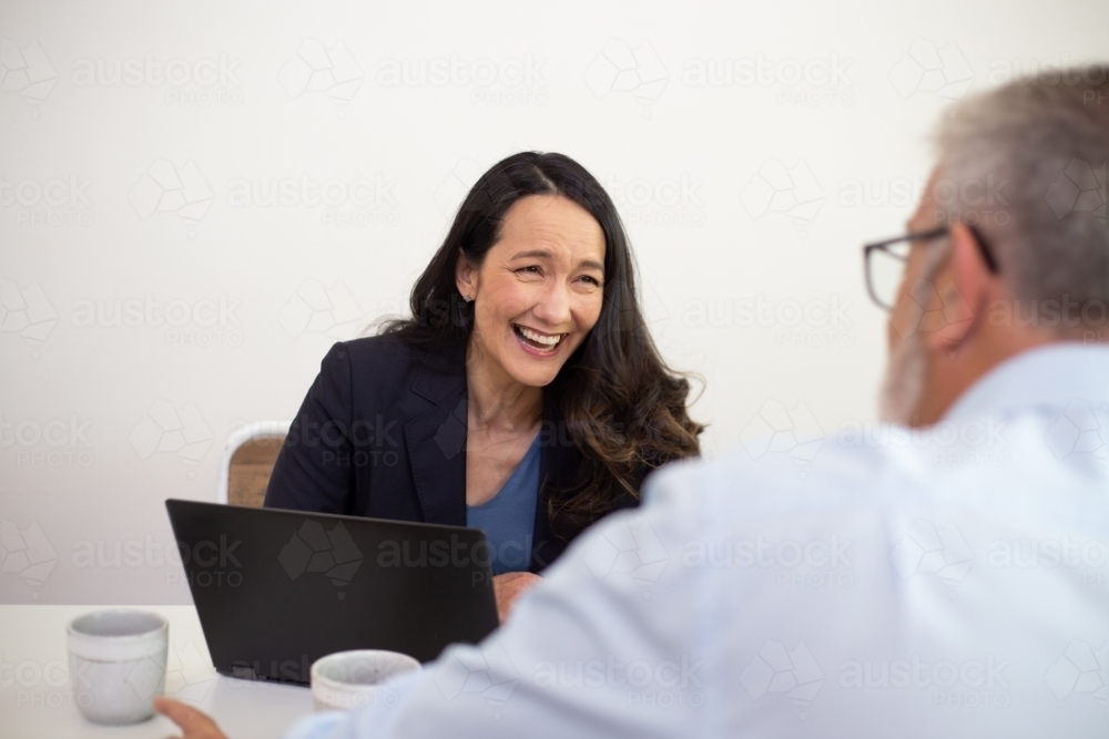 Man and woman collaborating in an office - Australian Stock Image