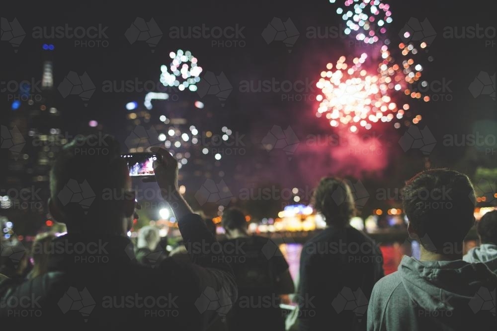 People watching Melbourne fireworks - Australian Stock Image
