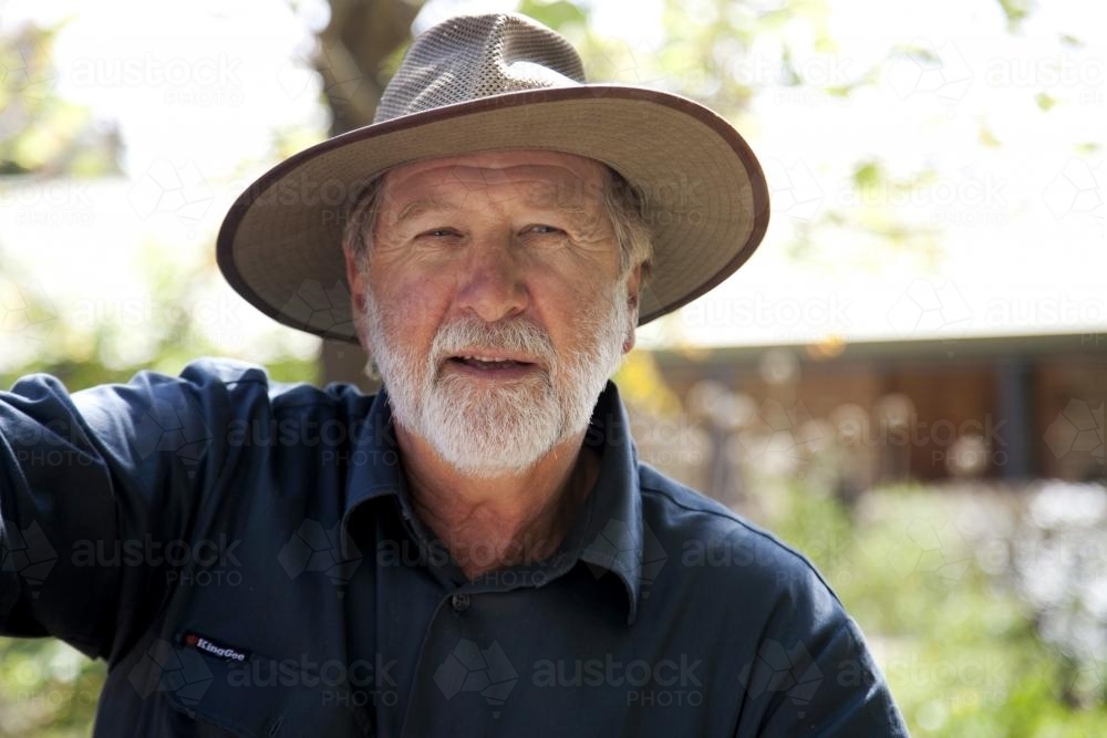 Portrait of middle aged male farmer outdoors on rural property - Australian Stock Image