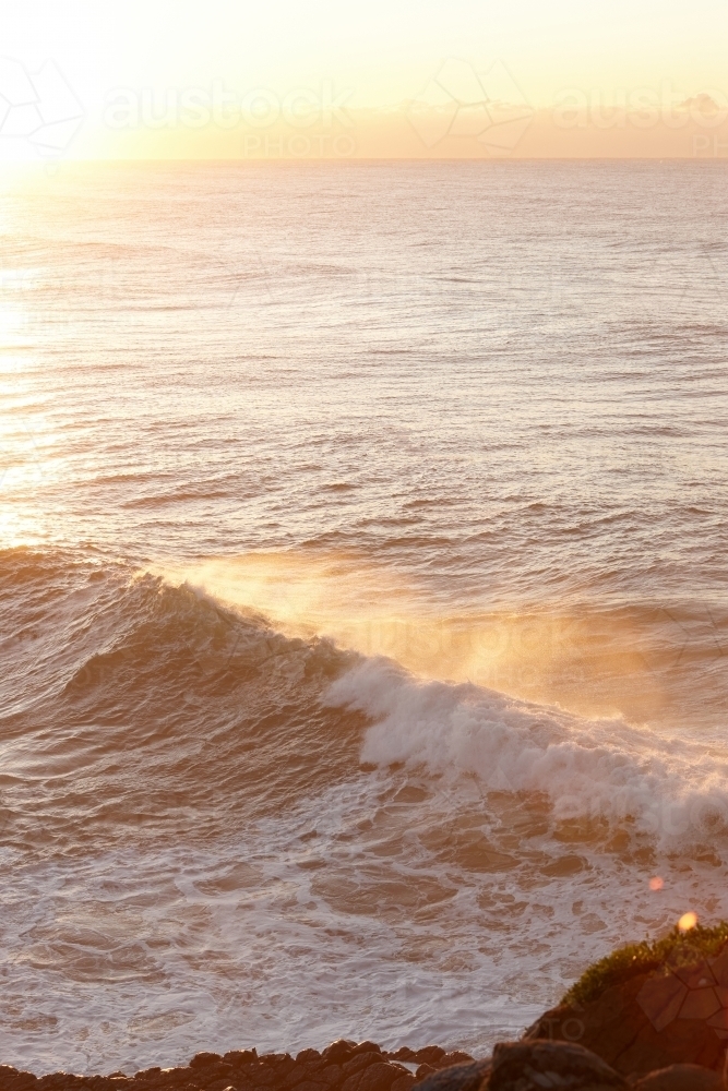 Seascape and large wave at sunrise - Australian Stock Image