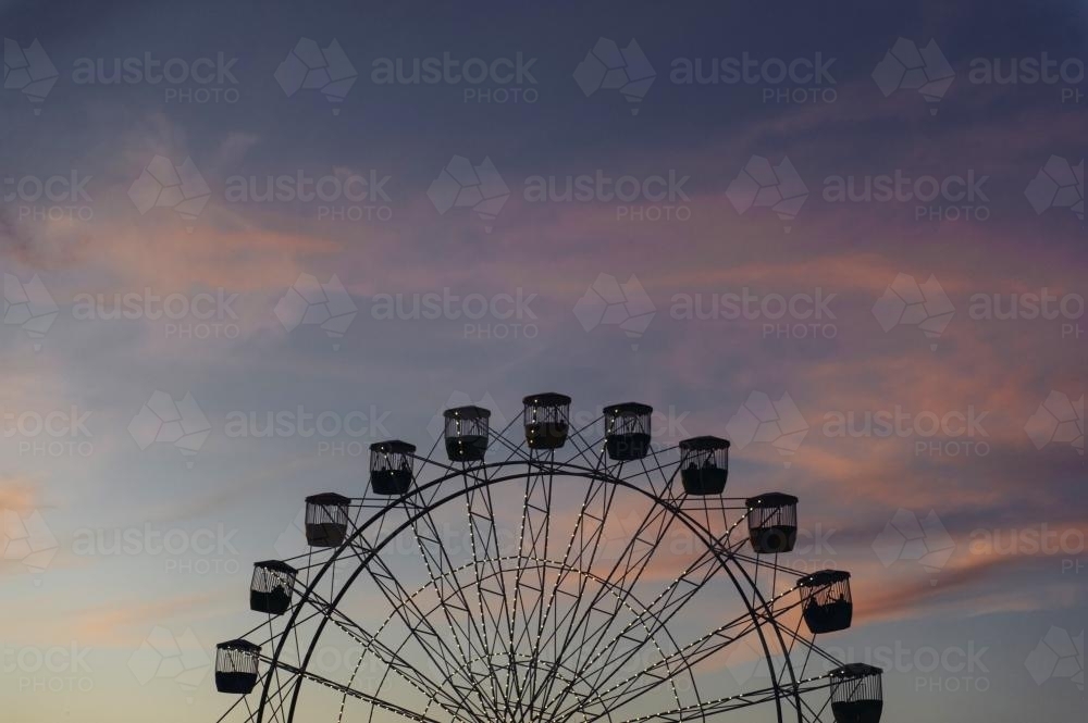 Silhouette of Ferris Wheel at Sunset - Australian Stock Image