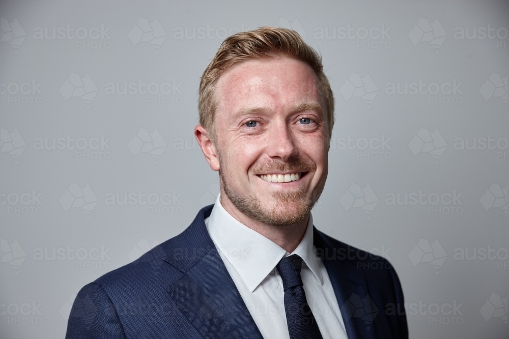 smiling middle aged man wearing suit and tie - Australian Stock Image