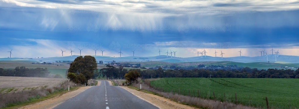 Storm clouds over wind turbines - Australian Stock Image