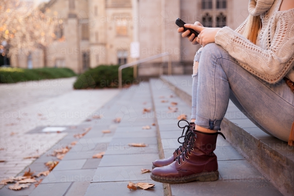 Student Texting on Smart Phone - Australian Stock Image