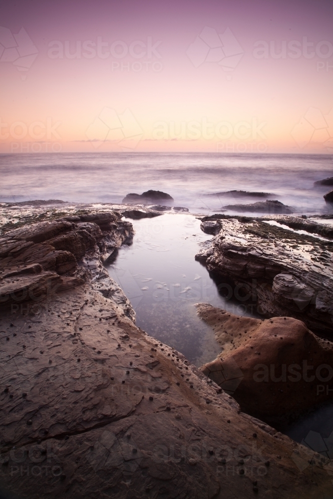 Sunset on a rock platform - Australian Stock Image