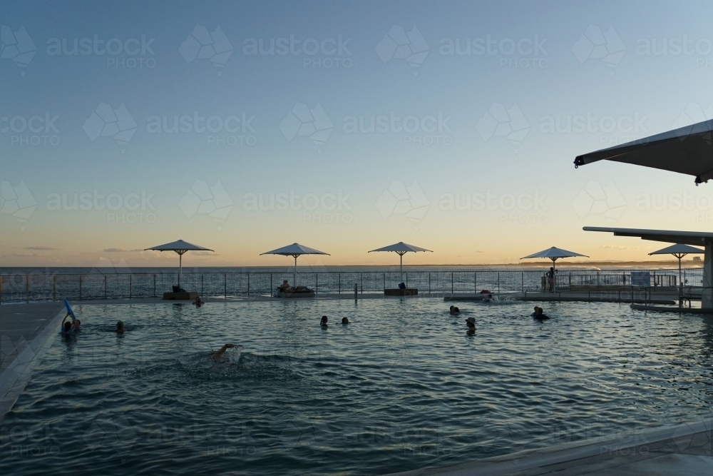 Swimmers in beach pool - Australian Stock Image