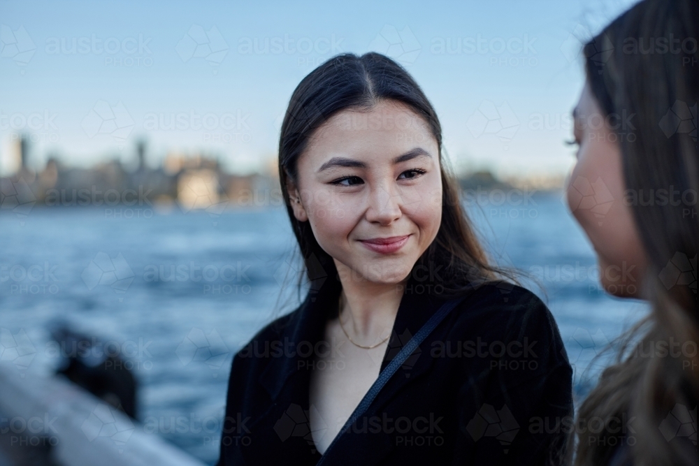 Two sisters spending time together harbourside - Australian Stock Image