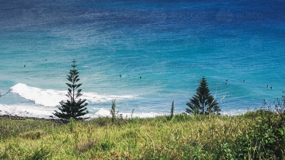View of surfers from hilltop - Australian Stock Image