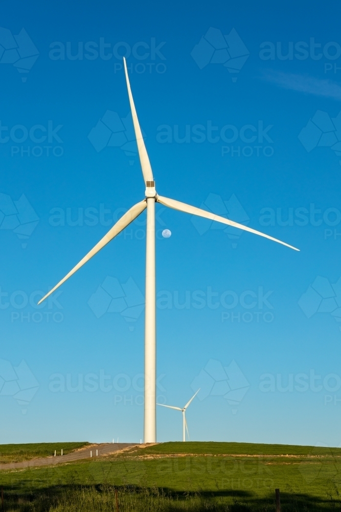 wind tower against blue sky - vertical - Australian Stock Image