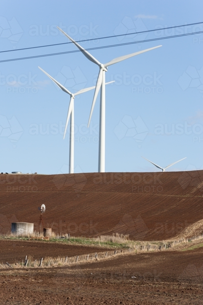 Wind turbines in tilled paddock - Australian Stock Image