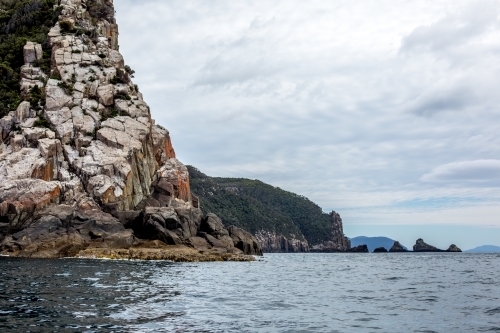 A view of towering sea cliffs from the water