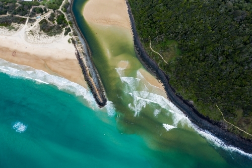 Aerial photo of a beach, river mouth and walking track