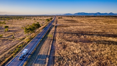 Aerial view caravan, bushland and highway of Mount Morgan during day time
