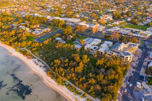 Aerial view of a coastal town and reserve near the beach