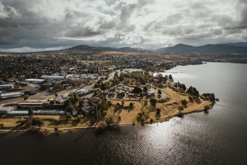 Aerial view of Jindabyne main town centre with the Snowy Mountains in the background