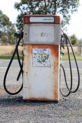 An old rusty petrol bowser in the country