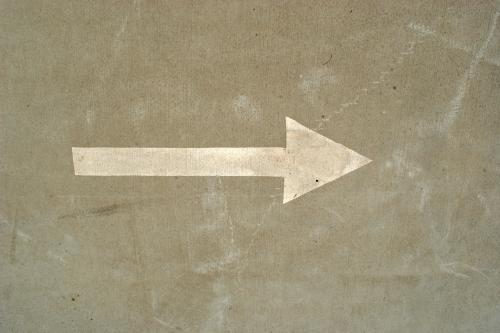 Arrow painted on the road, pointing to the right