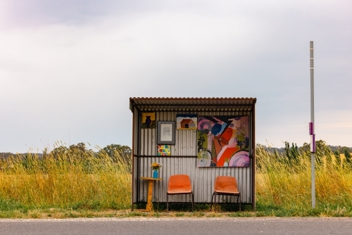 Authentic Aussie school bus stop with bright colours decorated with children's art