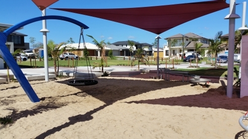 Children's playpark in suburban area with shade sails