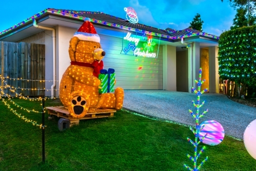 Christmas decorations in Queensland with a large teddy bear in front