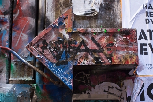 close up of graffiti covered arrow in Melbourne city