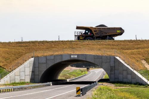 Coal truck driving over overpass