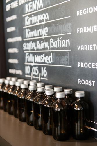 Coffee varieties on blackboard and display in a cafe