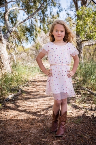 Country girl with polka dot dress and cowboy boots