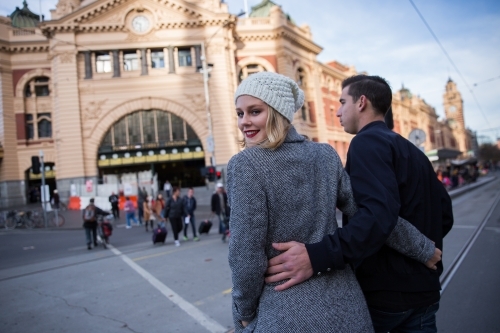 Couple Crossing Flinders Street to the Station