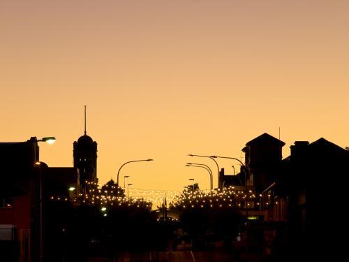 Dawn silhouette of Armidale main street with street lights