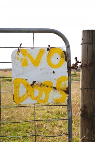 farm gate with No Dogs sign