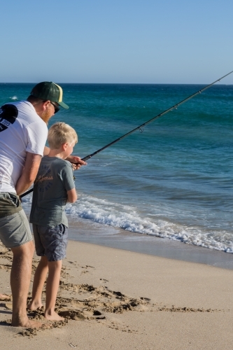 Father and son beach fishing