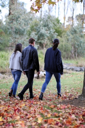 Group of young people walking in a rural environment in autumn